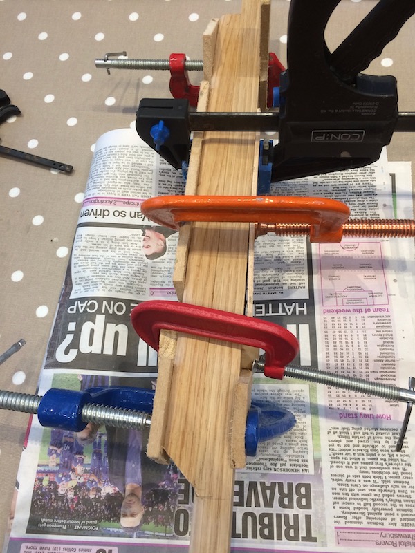Gluing the heel to the neck.