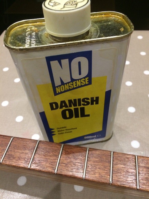 Applying 4 coats of Danish Oil to the neck.