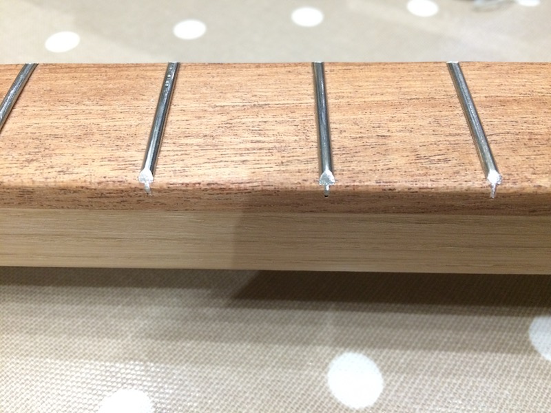 Fret edges sanded with the belt sander.