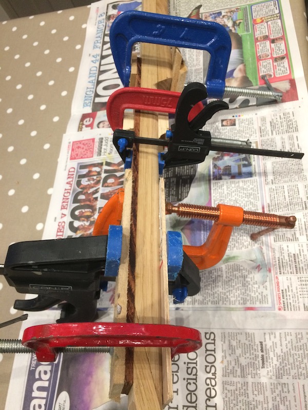 Gluing the fretboard to the neck.