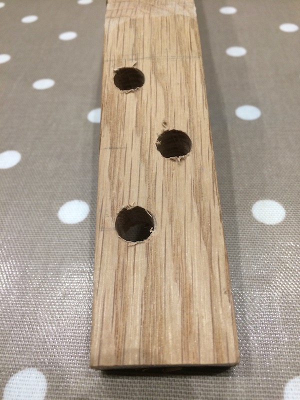 Holes cut for the tuning pegs. A 9.5mm is the perfect size. I've positioned the holes so the string do not overlap.