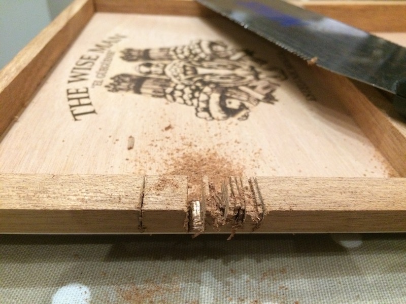 Notching the Cigar box lid to fit the neck. Sometimes the wood pops out really easily, but not this time. I'll cut the base of the box when I am happy with the angle of the neck.