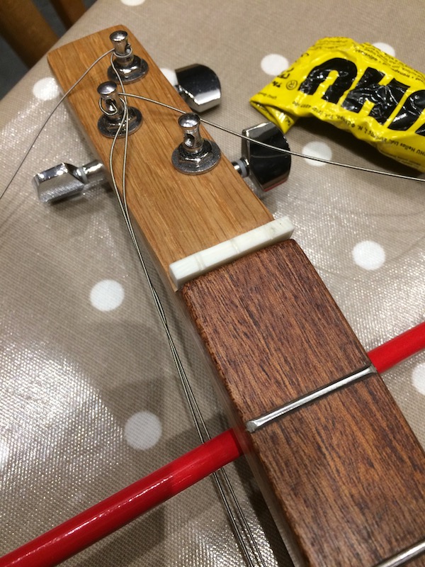 Nut lightly glued into place with a dab of UHU.