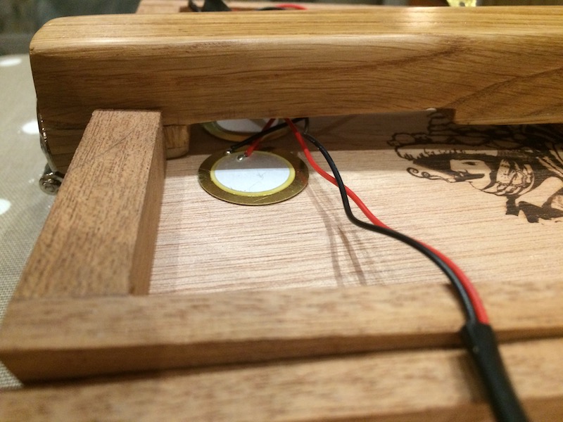 2 piezo pickups glued under the bridge