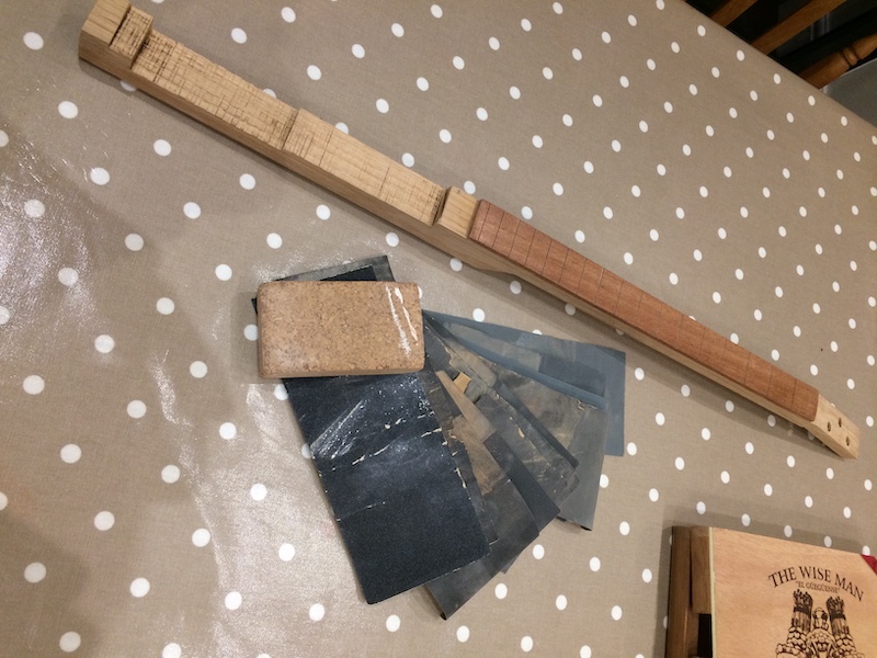 Sanding the fretboard as its easier to do so before fretting.