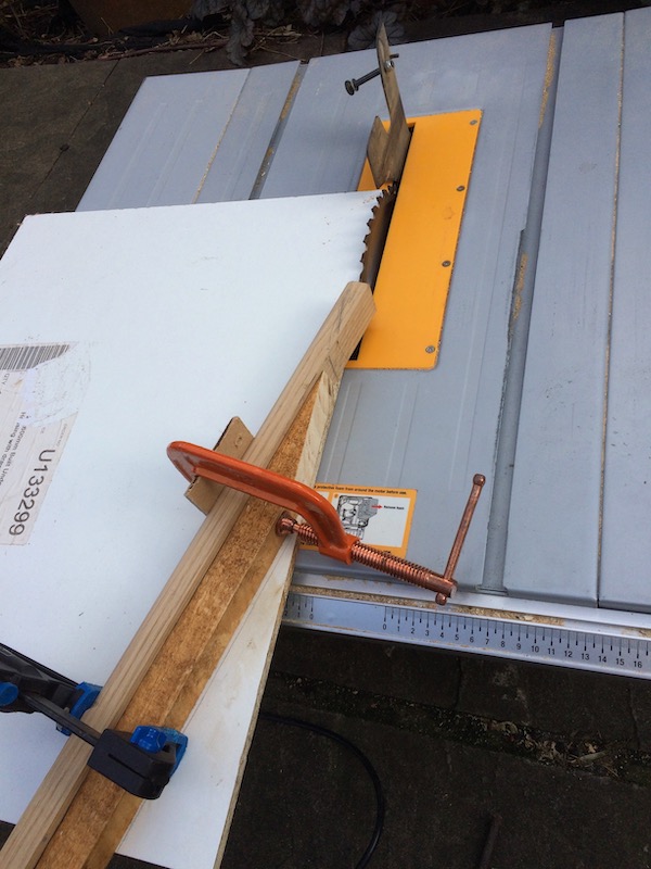 Cutting the scarf join on the table saw. After much experimentation I ended up making a sled for this cut.
