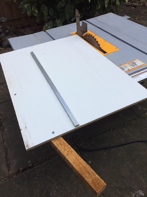 The back of the sled - the glued on metal bar fits nicely into the table slot to guide the sled.